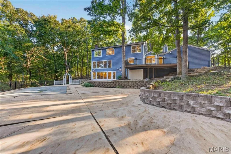 Large concrete patio around the pool. — 2436 Indian Tree Run, Wildwood, MO 63038