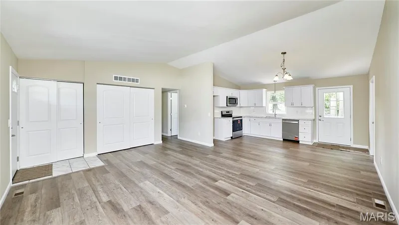 Vaulted ceiling, light and airy feeling, NEW kitchen and a polished nickel chandelier — 408 Raymond Drive, O'Fallon, MO 63366