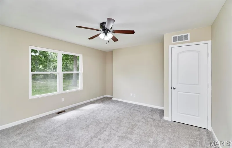 Bedroom #1Lots of natural light.  Larger bedroom for this size home and Walk-in Closets — 408 Raymond Drive, O'Fallon, MO 63366