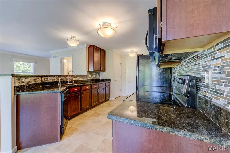 Beautiful cabinets with granite counter tops — 501 Country Circle Drive, Lake St. Louis, MO 63367
