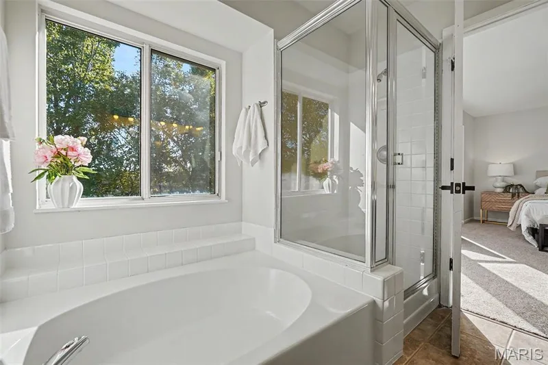Built-in soaking tub with separate glass-enclosed shower — 11 Castlio Court, St Charles, MO 63304