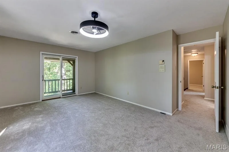 The master occupies the front corner, here's the hallway view from the master. — 3030 Woodlands, Wildwood, MO 63038