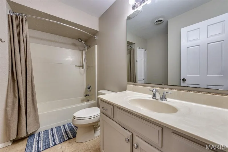 Hall bath and vanity size is perfect should all your bedrooms be occupied by little people. — 3030 Woodlands, Wildwood, MO 63038