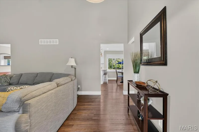 Wood-look luxury vinyl flooring throughout the main level. — 15056 Isleview Drive, Chesterfield, MO 63017