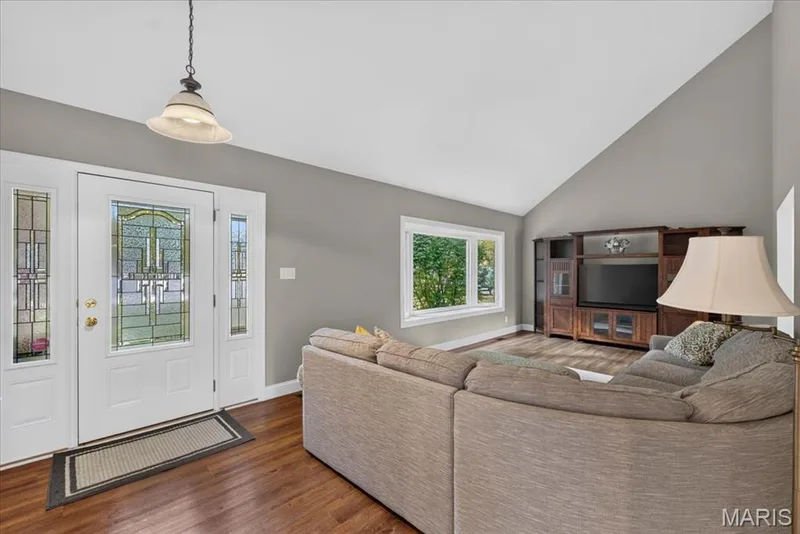 The living and dining rooms at the front of the home are bright and open. — 15056 Isleview Drive, Chesterfield, MO 63017