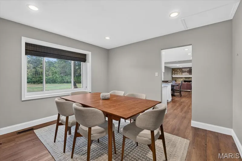 The dining room provides a peaceful view of the backyard. — 15056 Isleview Drive, Chesterfield, MO 63017