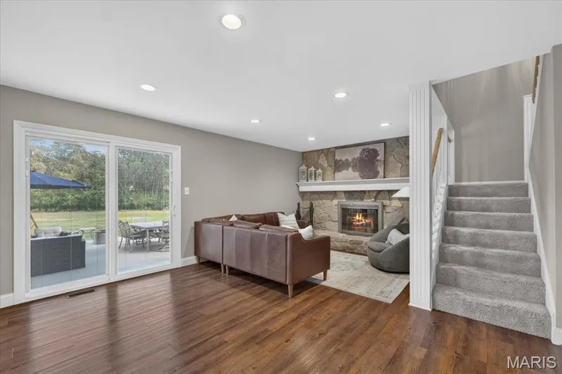 Sliding doors off the family room open to the redone patio (2021) and inviting backyard. — 15056 Isleview Drive, Chesterfield, MO 63017