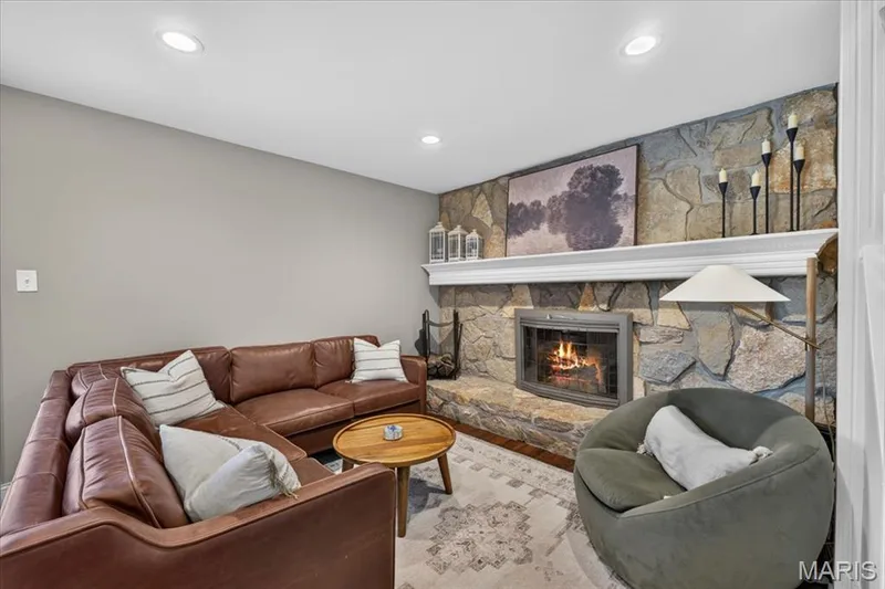 The family room is where you’ll want to settle in with the cozy stone fireplace. — 15056 Isleview Drive, Chesterfield, MO 63017