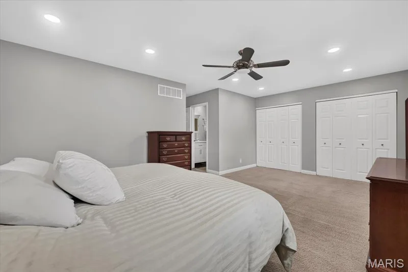 Tasteful finishes include recessed lighting and a ceiling fan. — 15056 Isleview Drive, Chesterfield, MO 63017