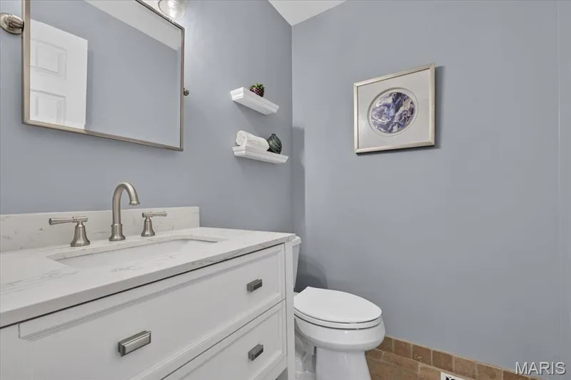 Main level powder room for guests. — 15056 Isleview Drive, Chesterfield, MO 63017
