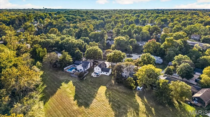Peaceful, tree-lined setting with expansive common ground stretching behind the home. — 15056 Isleview Drive, Chesterfield, MO 63017