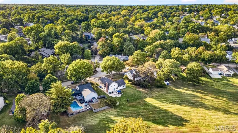 An expansive green backdrop sets this home apart within the neighborhood. — 15056 Isleview Drive, Chesterfield, MO 63017