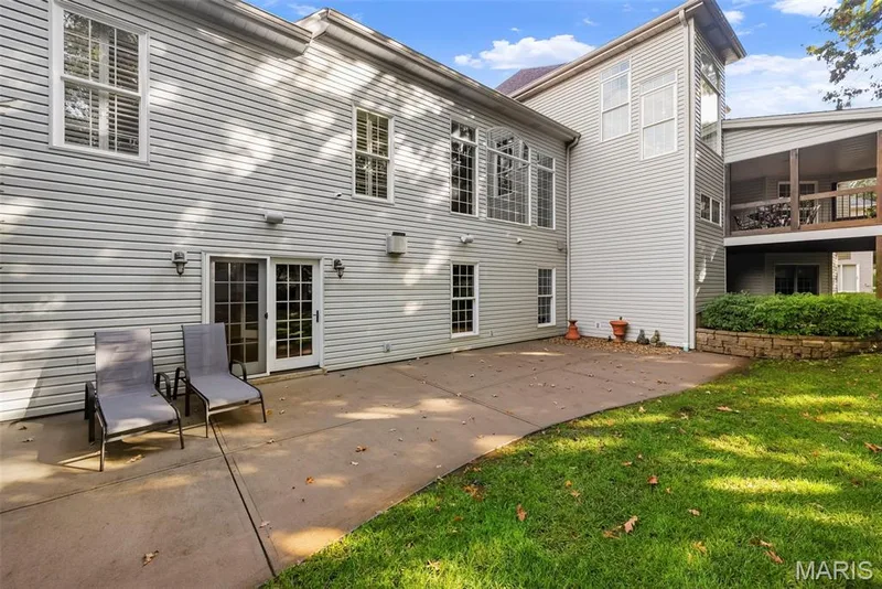Exterior featuring a concrete patio, and an elevated covered Deck. — 112 Castlewood Estates Drive, O'Fallon, MO 63368