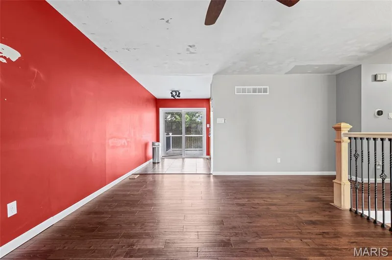 Living room flows to the dining area and the slider to the deck. — 510 Keeney Drive, St Charles, MO 63304