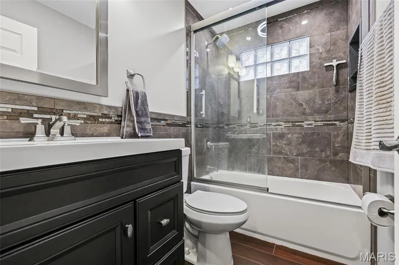 Updated vanity and tile in the main-level bath. — 510 Keeney Drive, St Charles, MO 63304