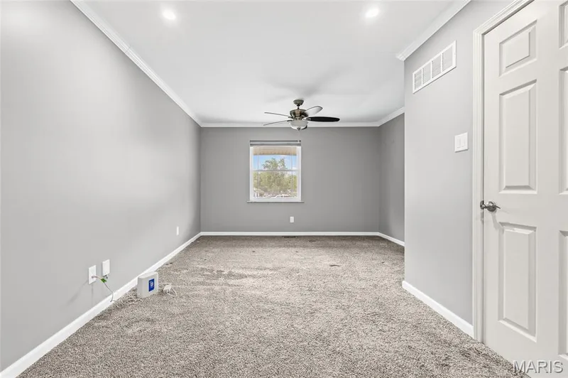 Primary bedroom with crown molding, ceiling fan and recessed lighting. — 510 Keeney Drive, St Charles, MO 63304