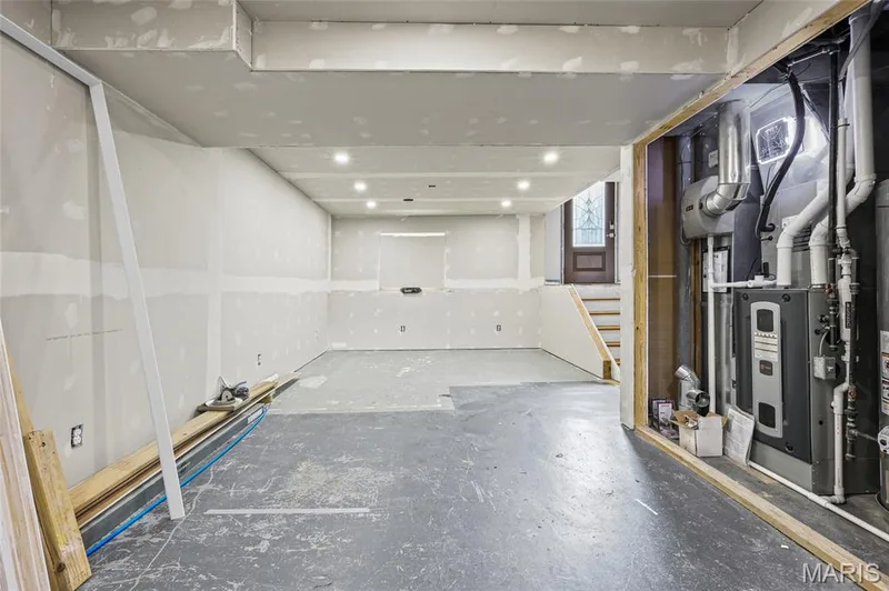 Unfinished 12' x 23' recreation room. 2018 high-efficiency furnace and gas water heater in the mechanical area. — 510 Keeney Drive, St Charles, MO 63304