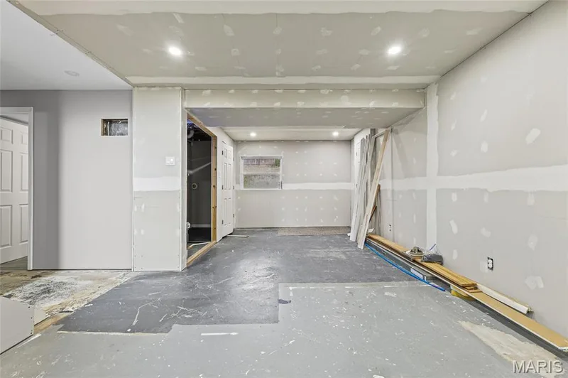 Lower hall, unfinished: drywall up, flooring and trim to finish. — 510 Keeney Drive, St Charles, MO 63304