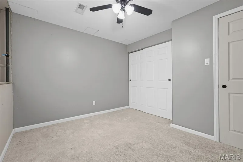 Lower-level Bedroom 2 with sliding-door closet. — 510 Keeney Drive, St Charles, MO 63304