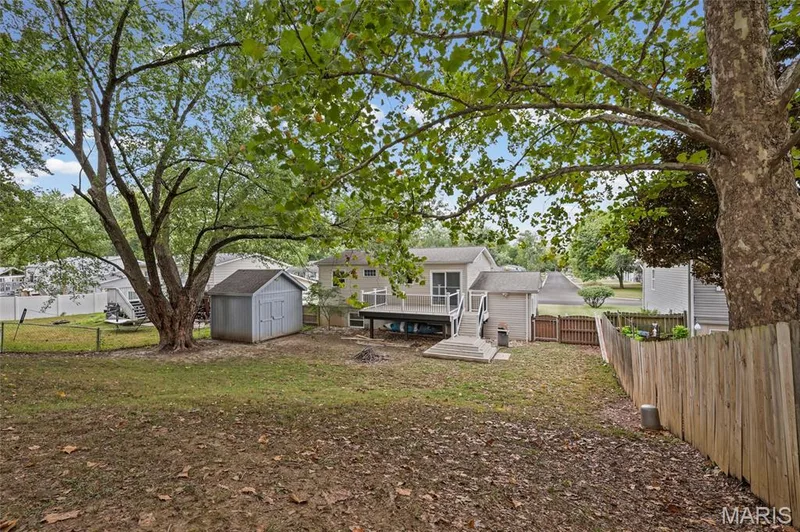 Fenced back yard with mature shade trees and storage shed. — 510 Keeney Drive, St Charles, MO 63304