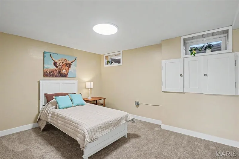 Built-in wall cabinetry, recessed window, and wall-to-wall carpeting — 81 Schooner Lane #1, Lake St. Louis, MO 63367