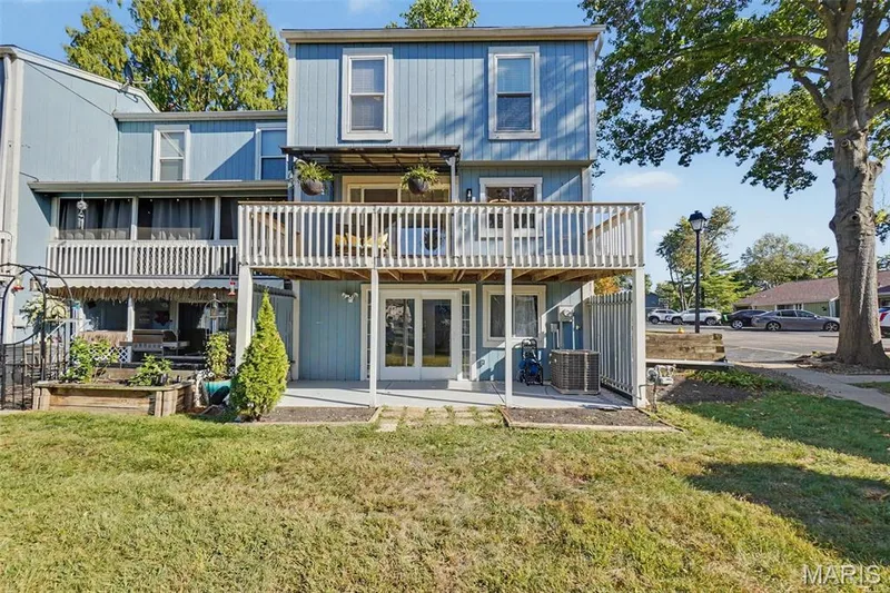Multi-level exterior with a second-story balcony and a ground-level patio — 81 Schooner Lane #1, Lake St. Louis, MO 63367