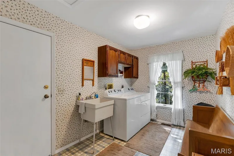 Spacious Laundry Room with sink and cabinets. Right off the garage — 29 Rockwood Forest Valley, Wildwood, MO 63025
