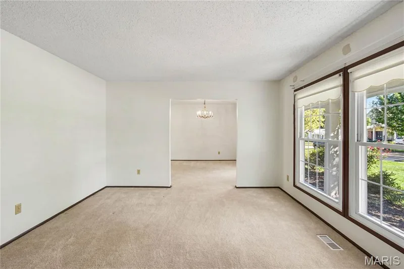 Double windows fill the formal living room with natural light! — 2311 Blue Hill Road, Chesterfield, MO 63017