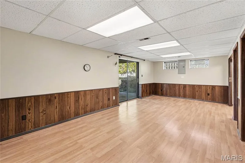 Walk-out basement opens to covered patio and flat, level backyard. — 2311 Blue Hill Road, Chesterfield, MO 63017