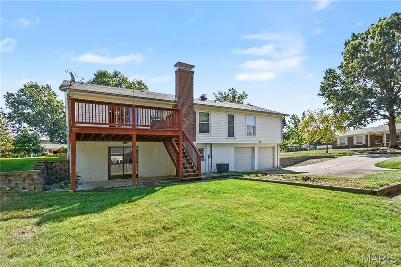 Deck, covered patio and flat, level backyard present lots of opportunities. — 2311 Blue Hill Road, Chesterfield, MO 63017