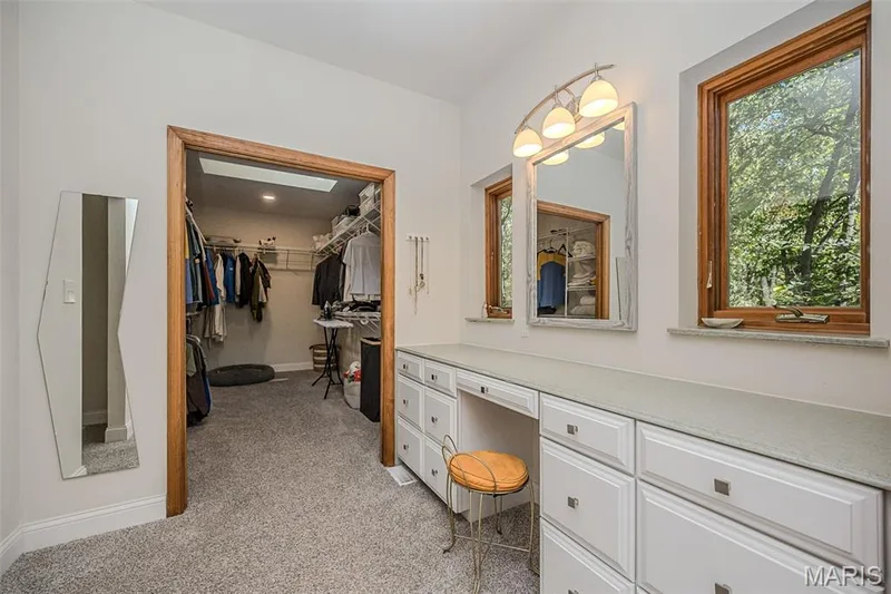 Dressing Room between the walk in closet and primary bath — 1302 Bear Canyon Road, Wildwood, MO 63021