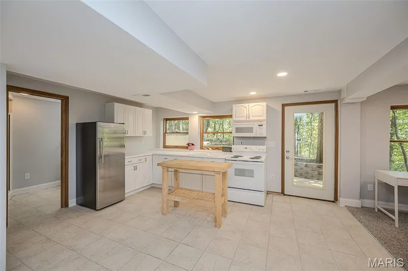 Full Kitchen at finished walkout lower level — 1302 Bear Canyon Road, Wildwood, MO 63021