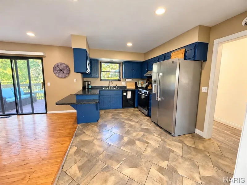 Open floor plan kitchen extending into the dining space — 111 Valvero Drive, St Charles, MO 63304