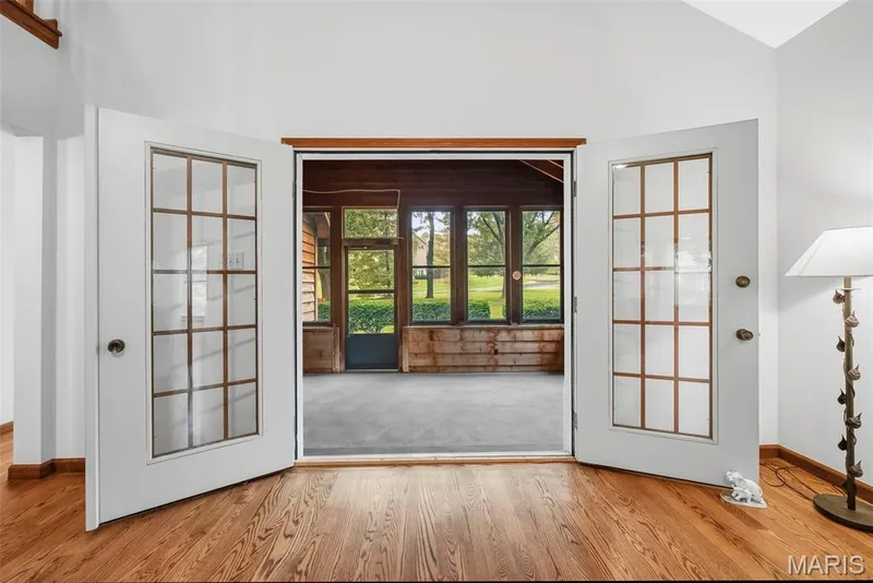 Double door entry to the screened in porch — 29 Number Six Green Drive #A, St Charles, MO 63303