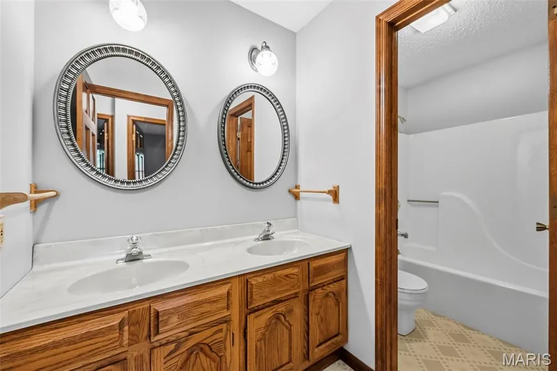 Door between the sink and shower makes for easy convenience — 29 Number Six Green Drive #A, St Charles, MO 63303