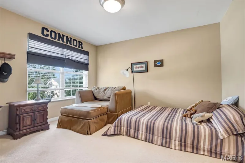 Neutral wall palette with carpeted flooring and large window featuring natural light — 2061 Avalon Mist Circle, Dardenne Prairie, MO 63368