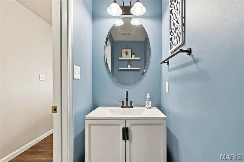 Half bath on main level near entry and stairs — 429 Spring Trace, O'Fallon, MO 63368