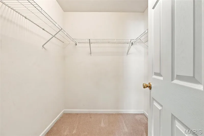 Walk-in closet #1 in the primary bedroom — 429 Spring Trace, O'Fallon, MO 63368