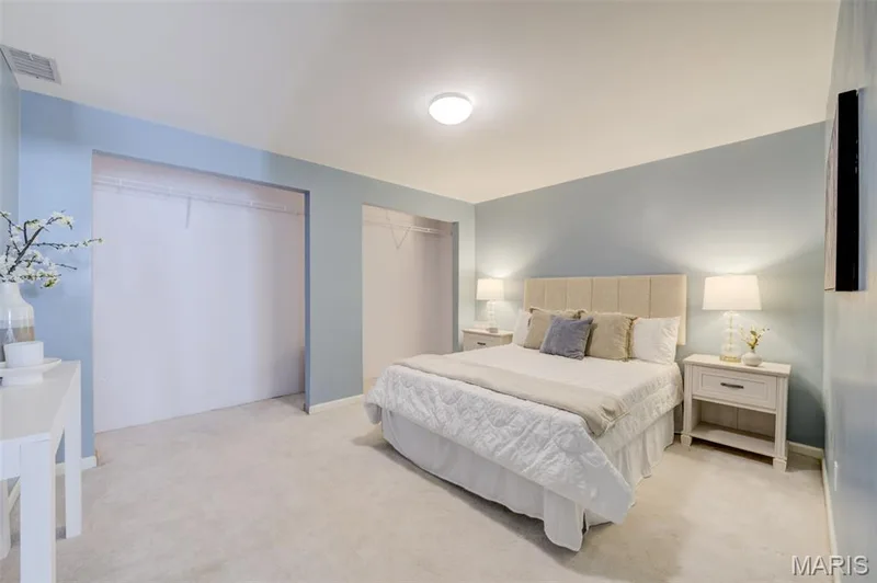 Recessed lighting illuminates this room featuring wall-to-wall carpeting and neutral wall tones — 1094 Harness Drive, St Charles, MO 63304