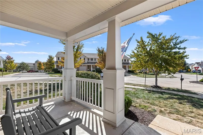 Your covered front porch is perfect for watching the leaves change while drinking your morning coffee! — 819 Country Field Drive, Lake St. Louis, MO 63367