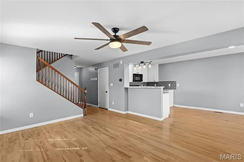 Living room flows into the Kitchen with a breakfast bar between, perfect for entertaining friends! — 819 Country Field Drive, Lake St. Louis, MO 63367