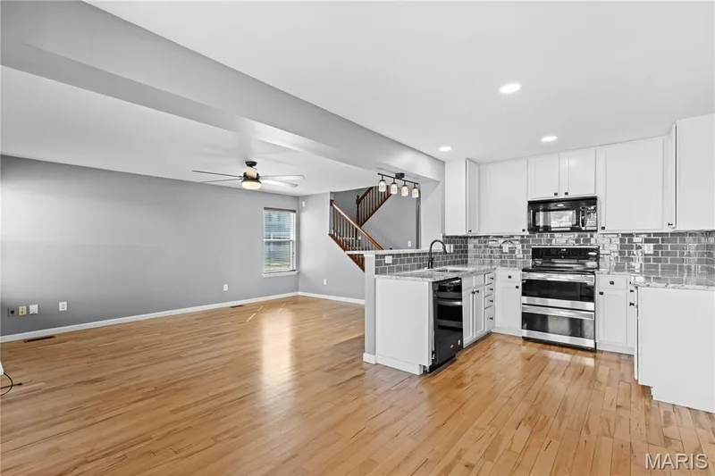 The open concept floor plan on the main level is the heart of the home! — 819 Country Field Drive, Lake St. Louis, MO 63367