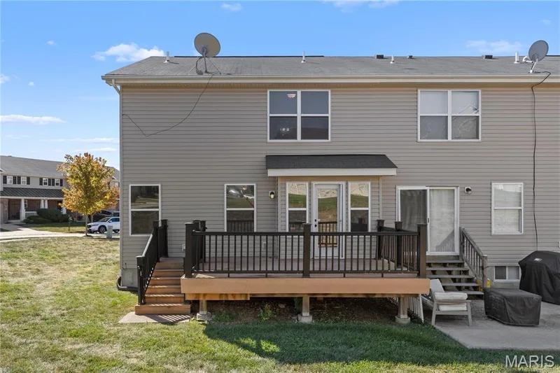 This townhouse is an end unit giving you more outdoor space than most with a side yard & large deck! — 819 Country Field Drive, Lake St. Louis, MO 63367