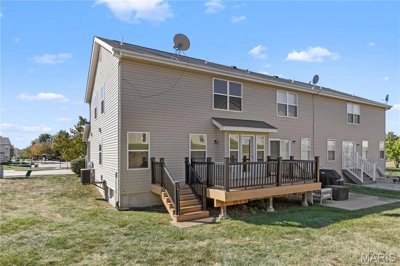 Large deck on this end unit townhouse gives you more outdoor space than most! — 819 Country Field Drive, Lake St. Louis, MO 63367