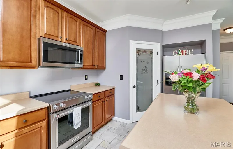 Stainless Steel Kitchenaid appliances include built-in microwave, electric range and dishwasher — 7428 Heathermoor Lane, Dardenne Prairie, MO 63368