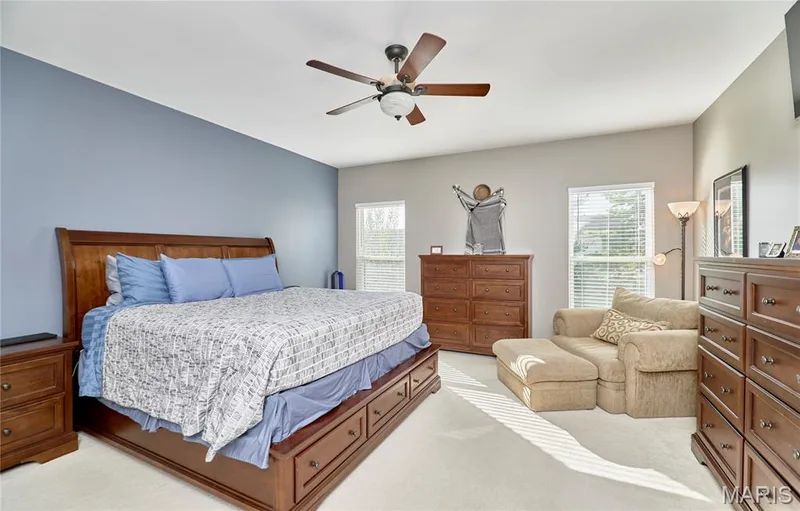 Primary Bedroom suite is generous in size with ceiling fan with access to an inviting luxury bath — 7428 Heathermoor Lane, Dardenne Prairie, MO 63368