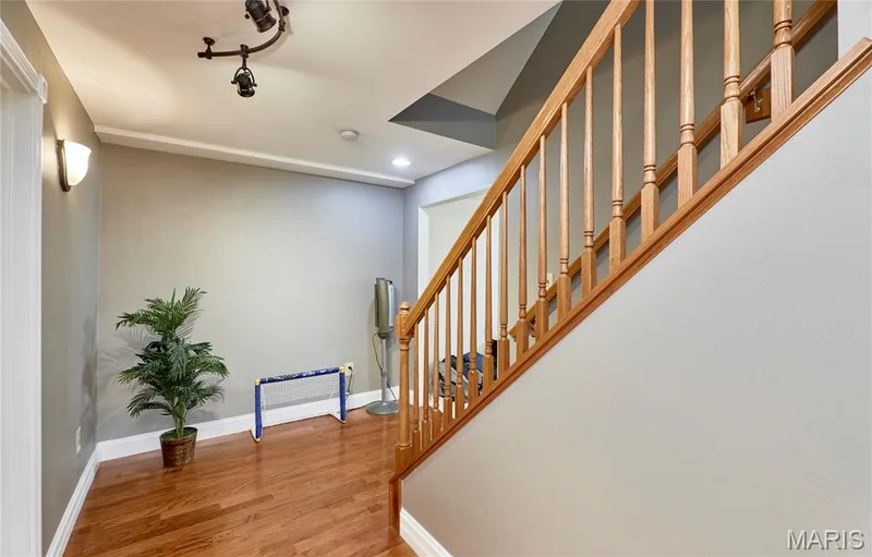 Spindle staircase to lower level — 7428 Heathermoor Lane, Dardenne Prairie, MO 63368