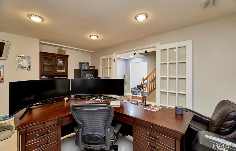 French doors open into an executive style home office, perfect for today's lifestyle — 7428 Heathermoor Lane, Dardenne Prairie, MO 63368