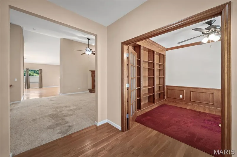 Entry foyer with office to the right. Could be turned back into your 2nd bedroom by removing the shelving and putting the closet back in. — 134 Fallon Villa Court, O'Fallon, MO 63368