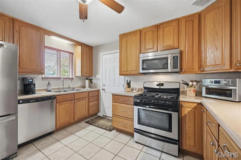 Kitchen with plenty of cabinet space — 35 Connie Drive, St Charles, MO 63301
